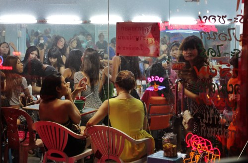 Women crowded into a 'beauty room' and watched like animals in a zoo